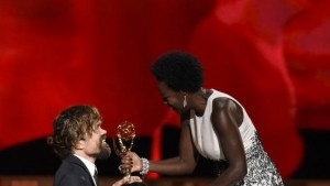 Viola Davis, right, presents Peter Dinklage with the award for outstanding supporting actor in a drama series for Game of Thrones at the 67th Primetime Emmy Awards on Sunday, Sept. 20, 2015, at the Microsoft Theater in Los Angeles. (Photo by Chris Pizzello/Invision/AP)